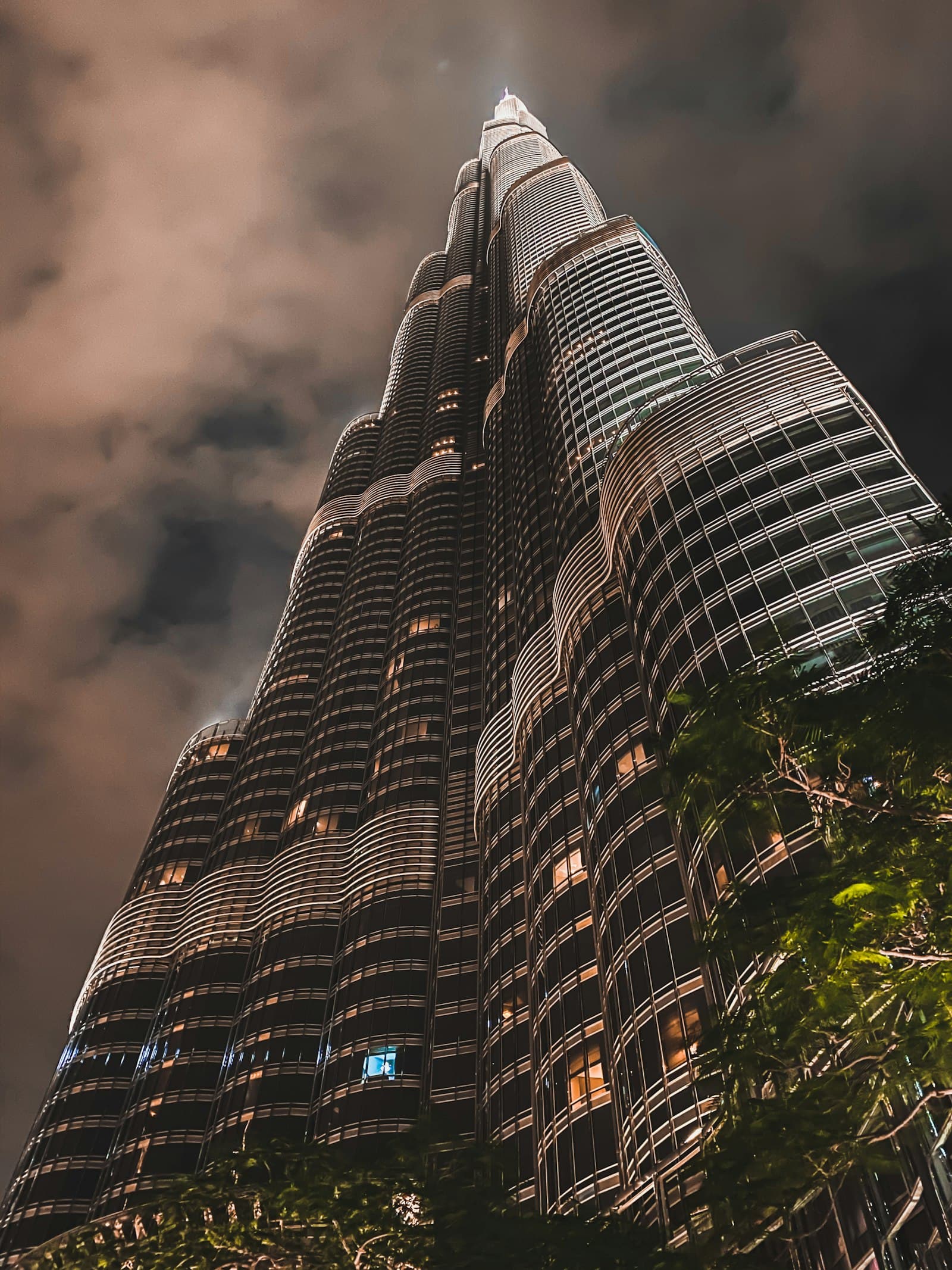 The facade of Burj Khalifa reaching into the clouds